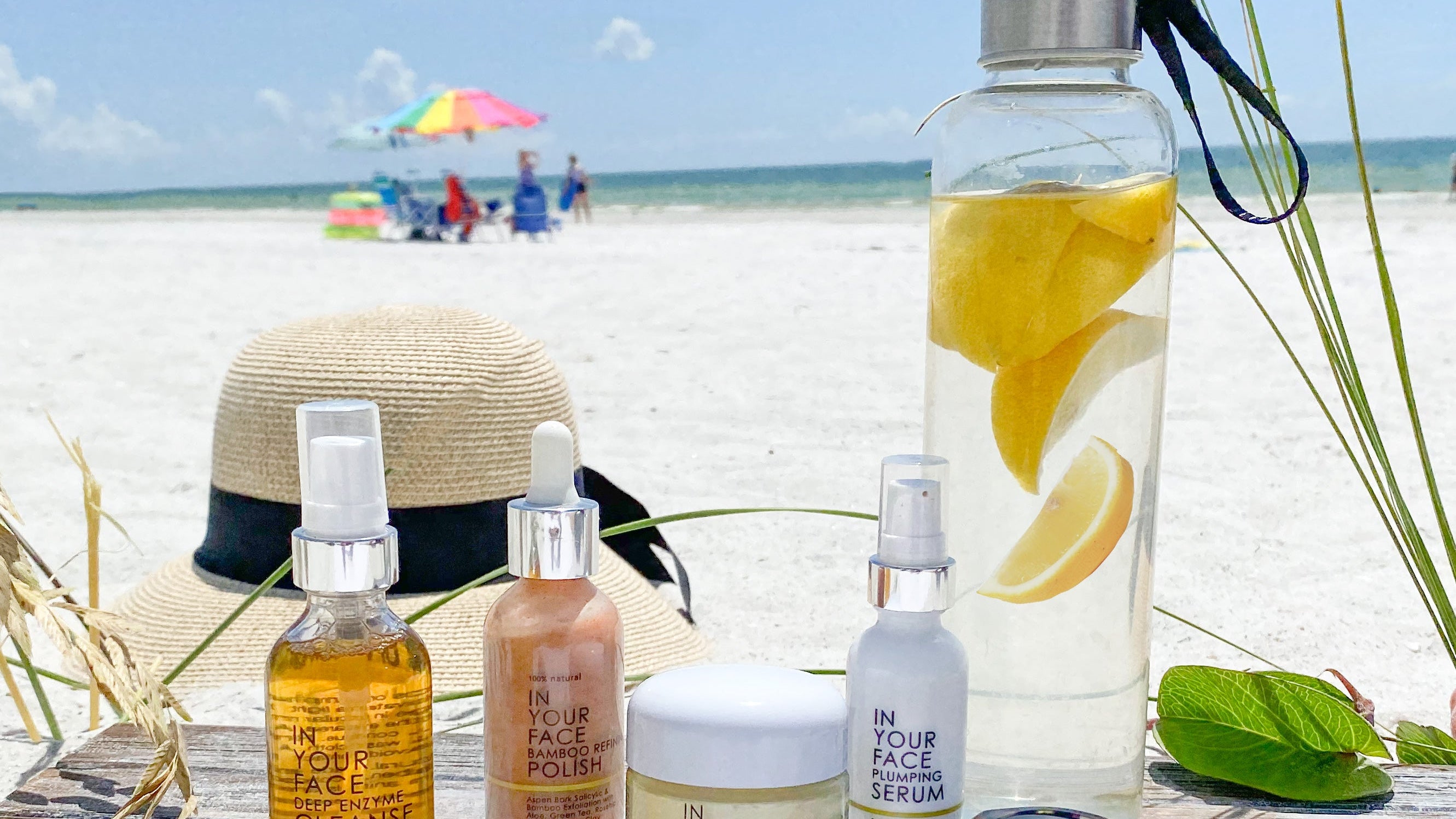 skincare products on the beach on wood