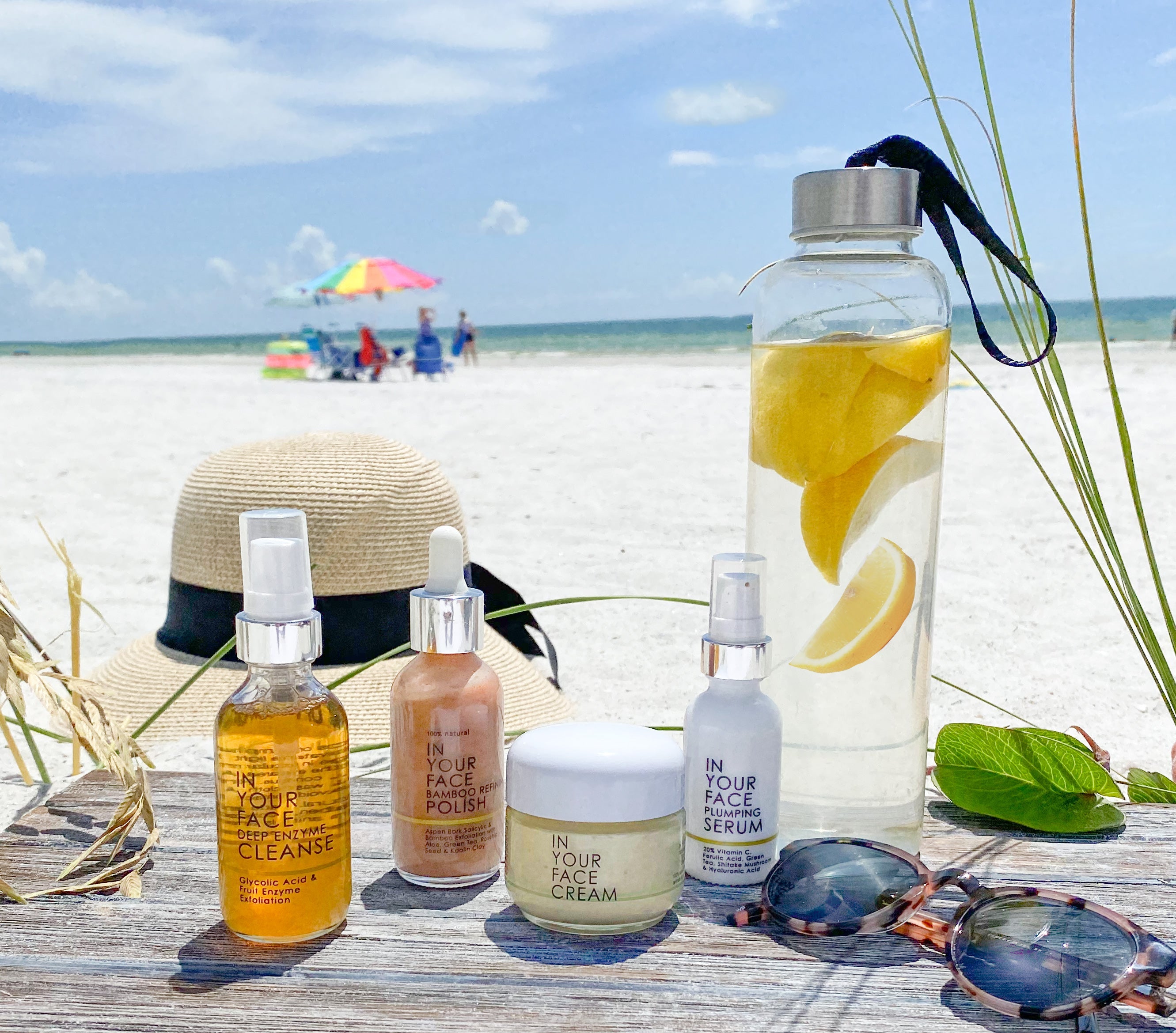 skincare products on the beach on wood
