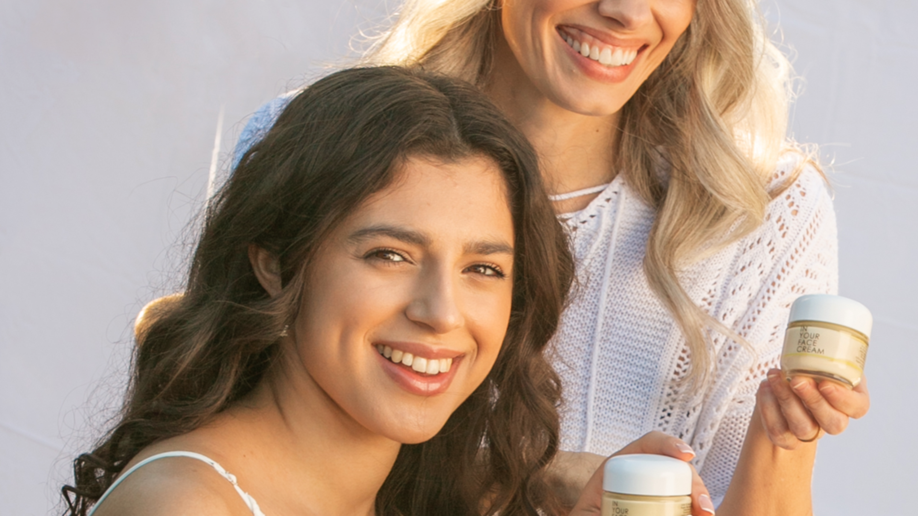 mature woman and young woman holding CREAMs