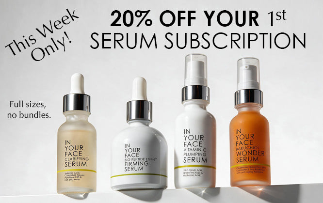 Four skincare serums from IN YOUR FACE are displayed on a white surface against a light gray background, with promotional text reading '20% OFF YOUR 1st SERUM SUBSCRIPTION' and 'This Week Only!'. The products include Clarifying Serum in a frosted beige bottle, Firming Serum in a white bottle, Vitamin Plumping Serum in a white bottle, and Wonder Serum in an orange bottle.