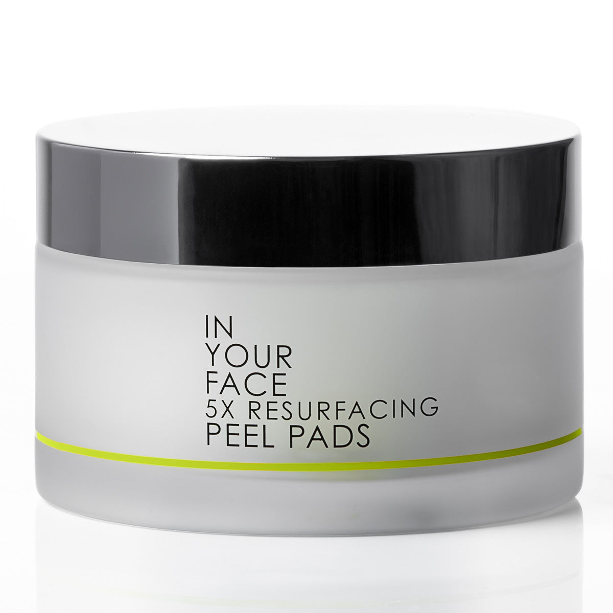A jar of IN YOUR FACE 5X RESURFACING PEEL PADS, featuring a frosted white container, a glossy black lid, and a thin lime green accent line on the front label.