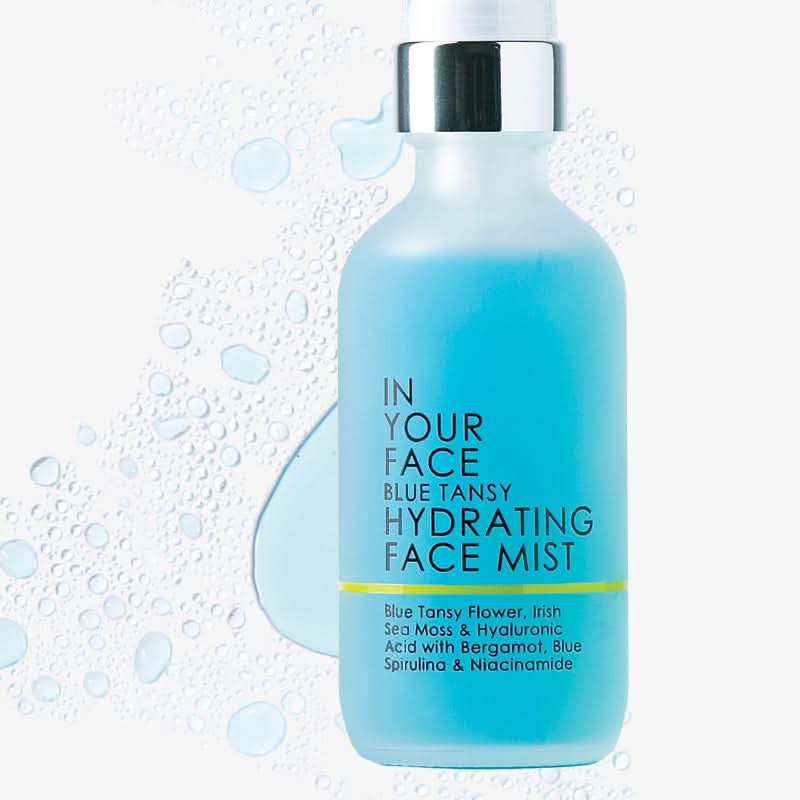 Blue hydrating face mist bottle with text on a white background