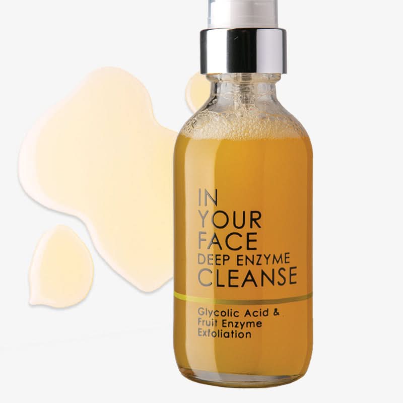 Skincare bottle labeled 'In Your Face Deep Enzyme Cleanse' on a white background