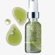 Bottle of 'In Your Face' moisturizing wash with green liquid and two droplets on a white background