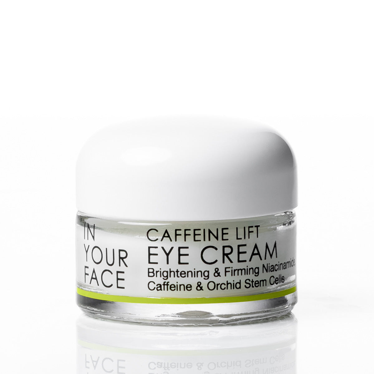 A small clear cosmetic jar with a white lid and a white label reading 'IN YOUR FACE CAFFEINE LIFT EYE CREAM' on a clean white background.