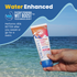 Hand holding a sunscreen tube with ocean background and 'Water Enhanced' text.
