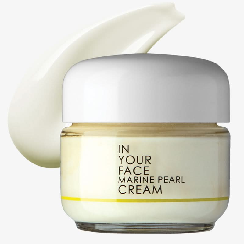 Jar of 'In Your Face Marine Pearl Cream' with a white cap on a white background