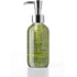A clear plastic pump bottle of 'In Your Face Moisturizing Wash' filled with greenish-yellow liquid, featuring a silver pump dispenser, set against a plain white background with a soft reflection below.