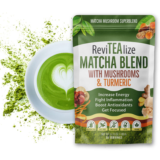 ReviTEalize Matcha Blend with Mushrooms & Turmeric in a green and white stand-up pouch, shown next to a white cup of matcha latte with heart-shaped foam art and green powder splashes on a white background.