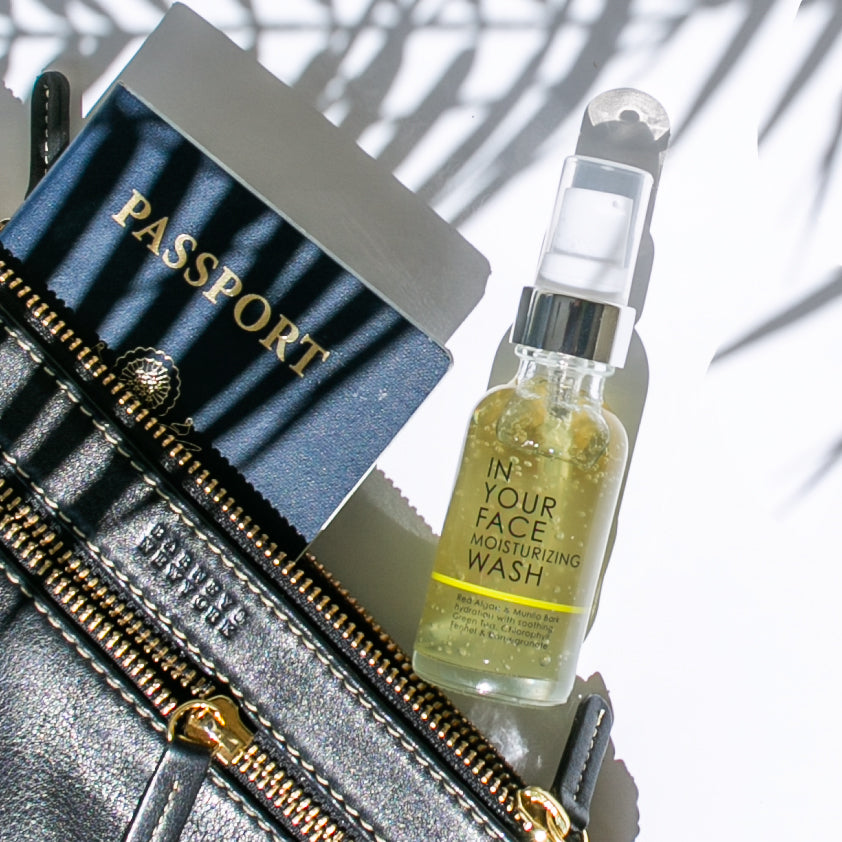 moisturizing wash MINI coming out of purse with passport