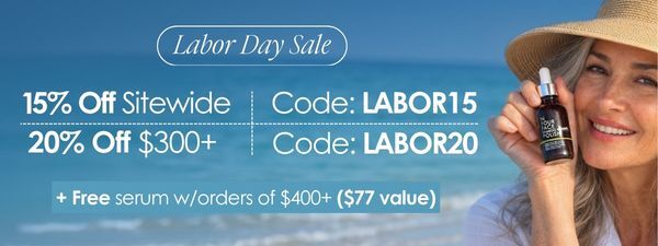 Labor Day Sale promotional banner with a woman in a straw hat holding a small serum bottle against a beach background, with discount text including 15% off sitewide, code LABOR15, 20% off $300+, and a free serum offer.