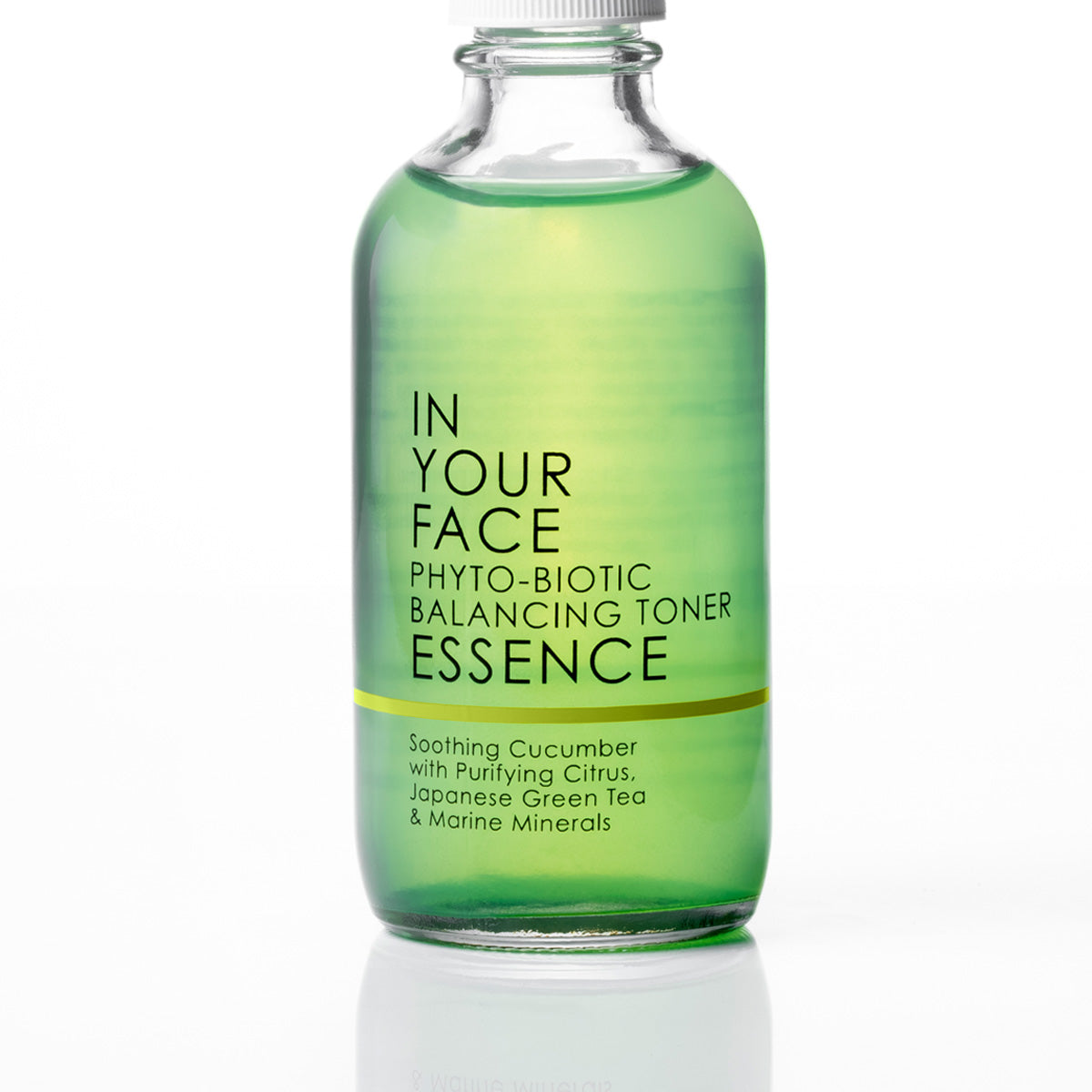 A clear glass bottle of IN YOUR FACE Phyto-Biotic Balancing Toner Essence, filled with a green liquid and featuring a white cap, set against a clean white background with a soft reflection.
