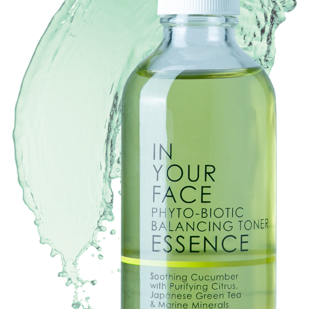 Bottle of PHYTO-BIOTIC BALANCING TONER ESSENCE in front of splash on white background