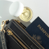 the CREAM - MINI next to travel documents