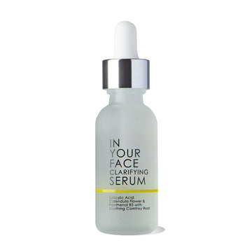 a bottle of the IN YOUR FACE CLARIFYING SERUM on a white background with a small shadow underneath the bottle. It shows a pipette that you can squeeze as the dispenser for the product on top.