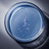 top view of serum in petri dish with reflections and shadows