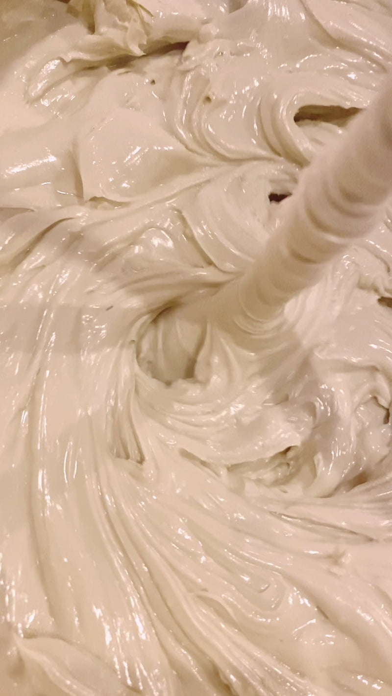 video of THE CREAM being blended - swirling in a bucket by a mixer blade