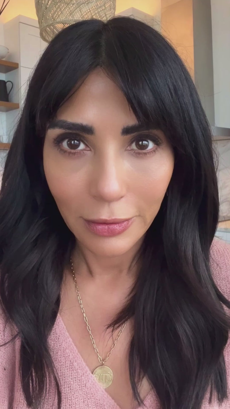 video of a woman talking about the cream an nourisging oil