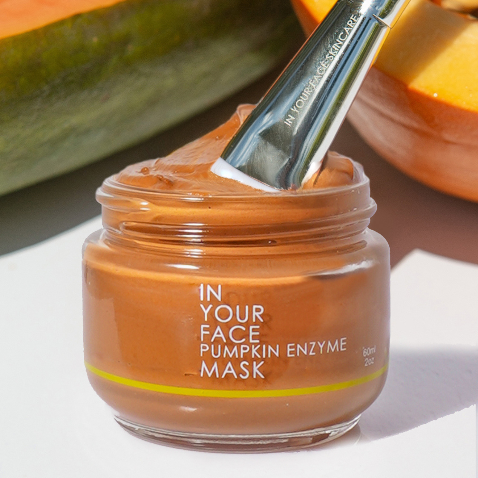 a picture of the PUMPKIN ENZYME MASK open with a MASK BRUSH inside.