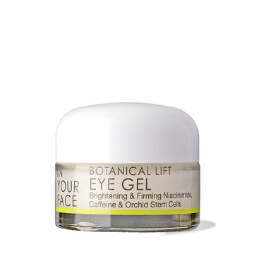 a jar of the IN YOUR FACE BOTANICAL LIFT EYE GEL. It appears to be a clear ivory color. The image says in addition to the title, "Brightening & firming niacinamide, Caffeine & Orchid Stem Cells"