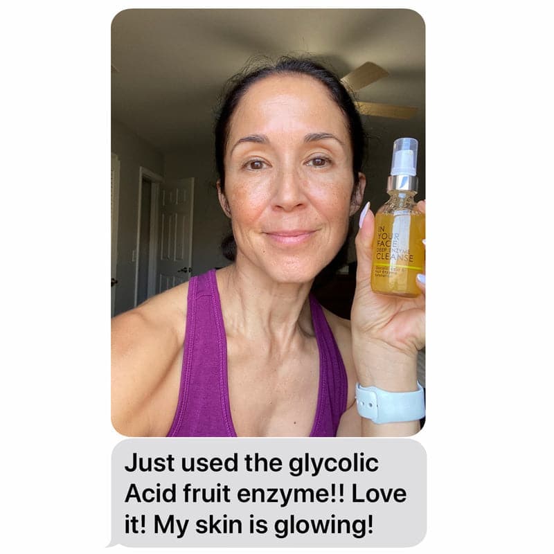 An early 50s woman is holding up a bottle of the DEEP ENZYME CLEANSE, with a chat bubble saying "Just used the glycolic Acid fruit enzyme!! Love it! My skin is glowing!"