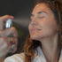 Denice Duff holding the MIST and spraying it.
