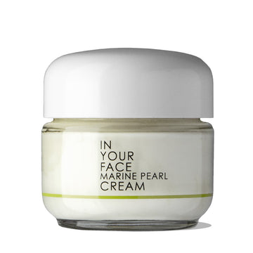 a clean image on a white background of IN YOUR FACE MARINE PEARL CREAM, with a small shadow under it. The cream looks like it is a soft very pale ivory color. 