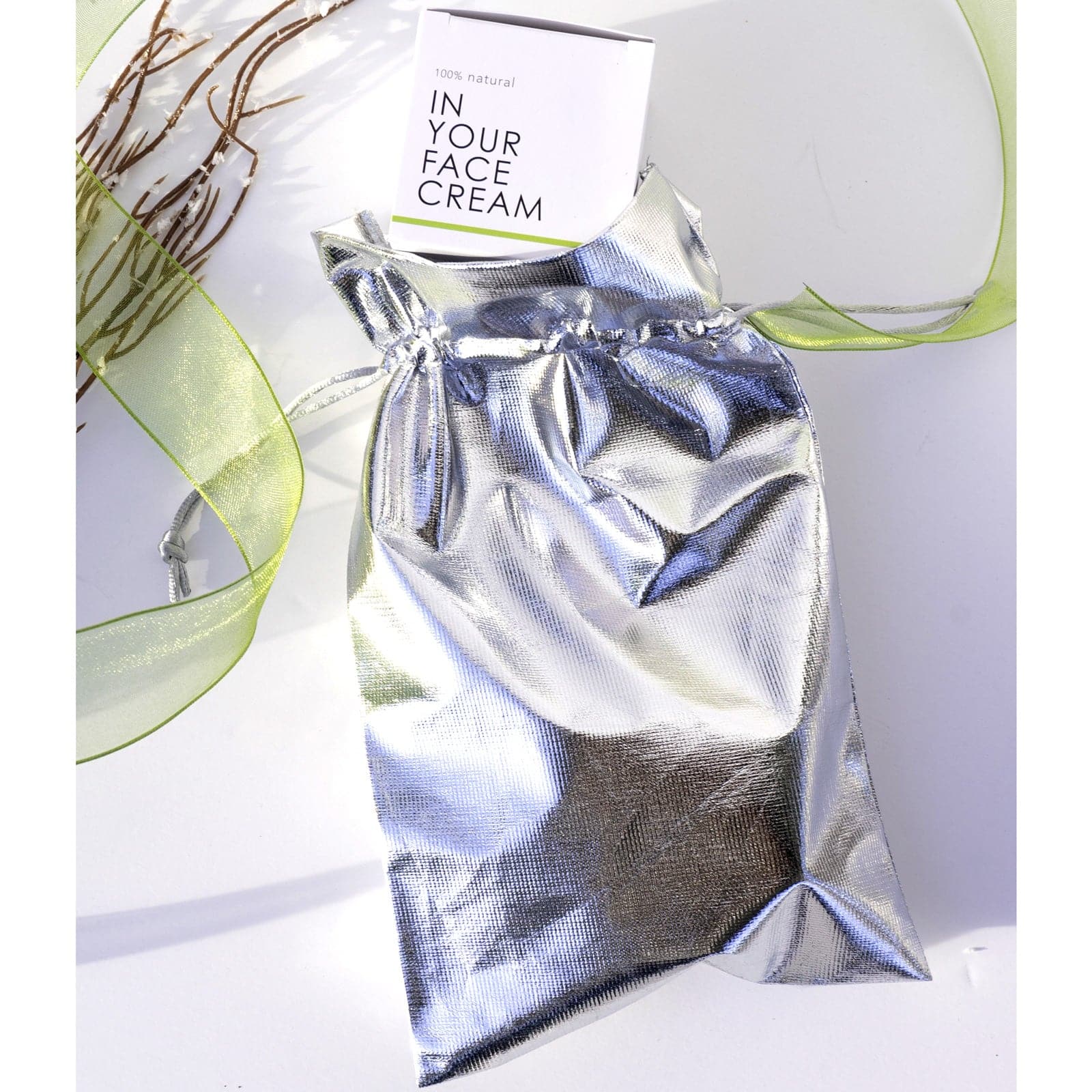 metallic gift bag holding THE CREAM inside