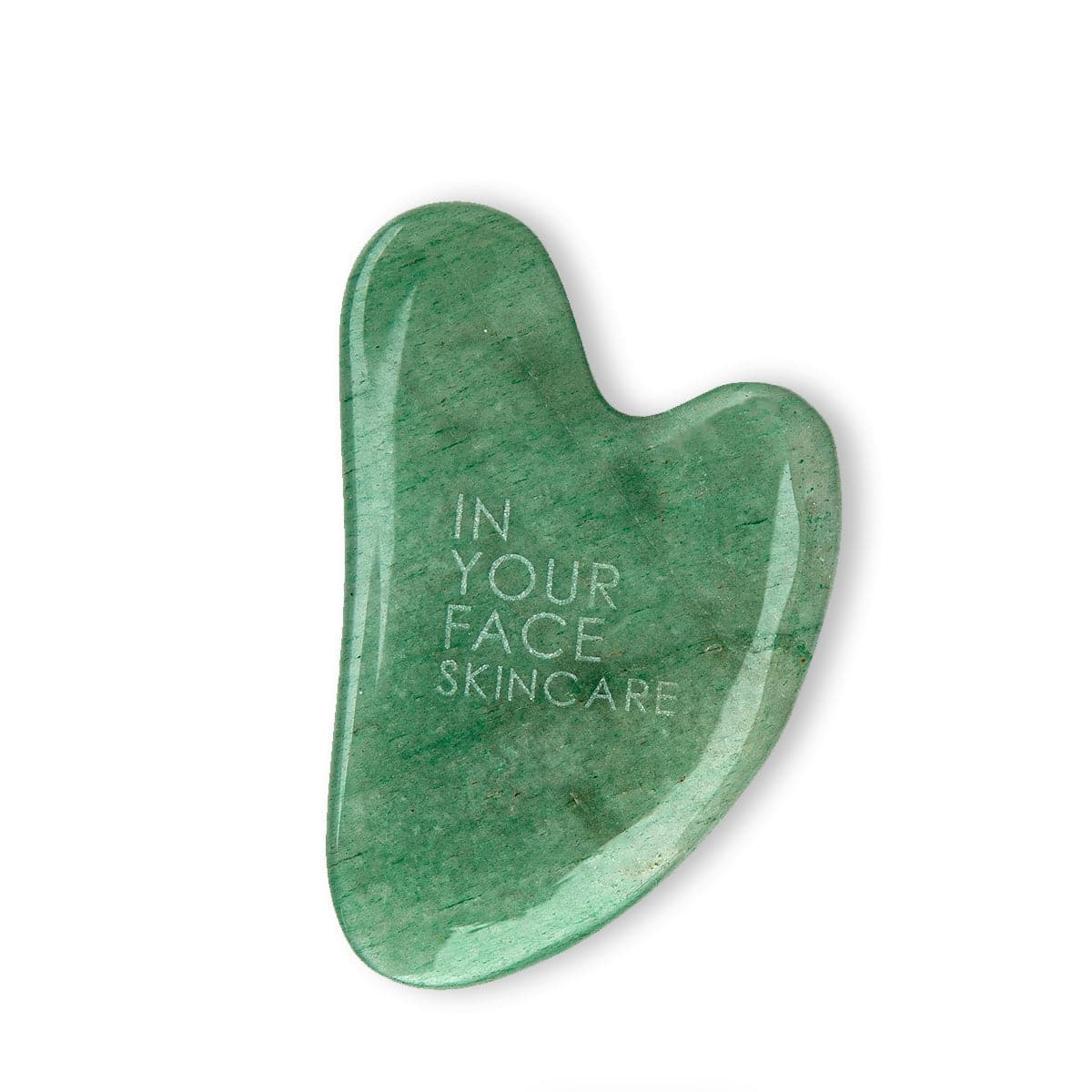 A clean photo of our IN YOUR FACE SKINCARE GUA SHA STONE on a white background. It is a medium green color with smooth round edges.